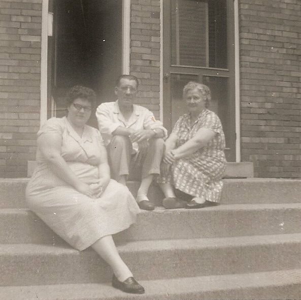 Nora, Chalmer, and "Bibby", in front of their house 2926 1/2 Markbreit in Norwood.